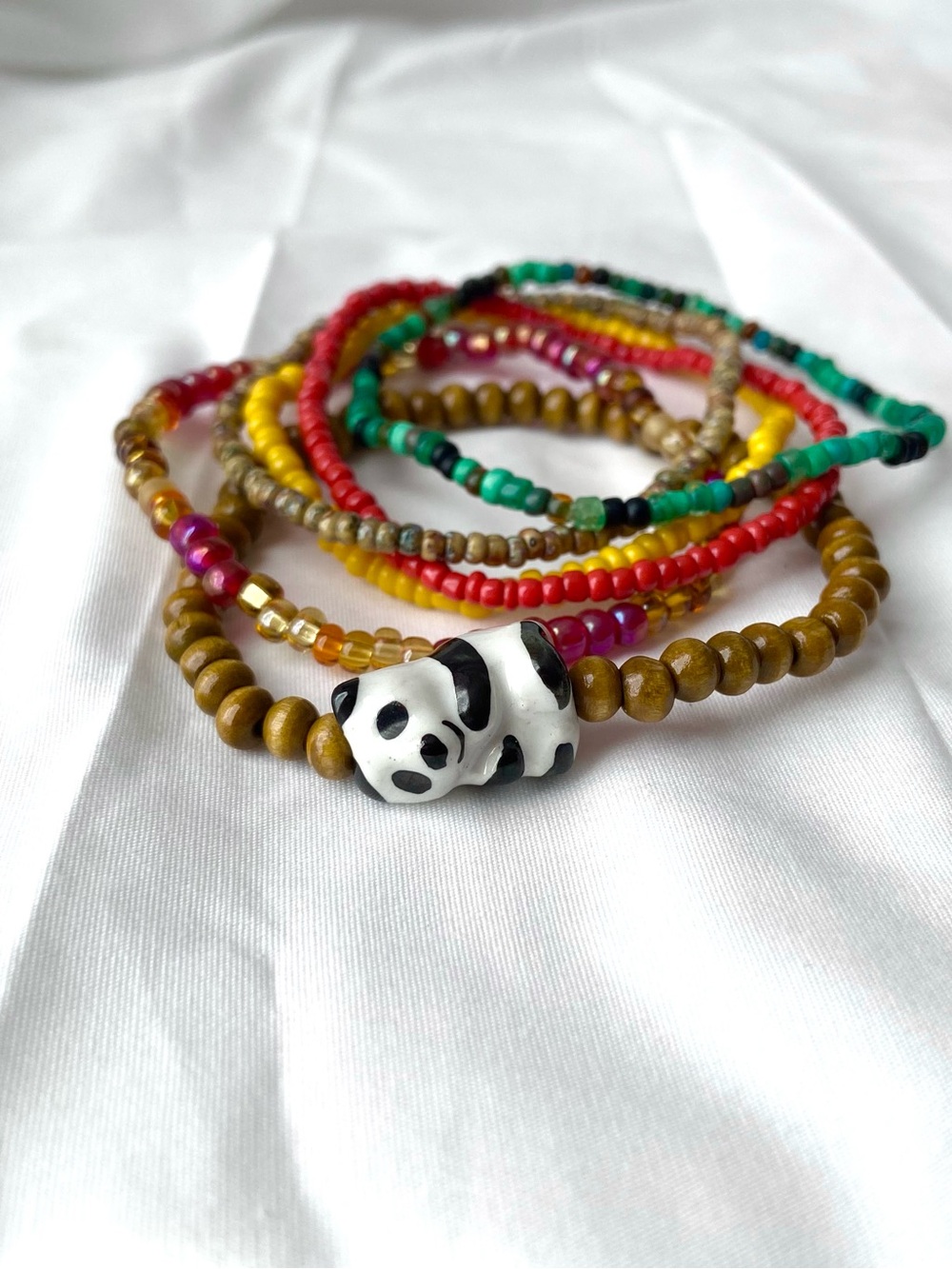 Six Multicolor Beaded Bracelet Stack with Panda Accent